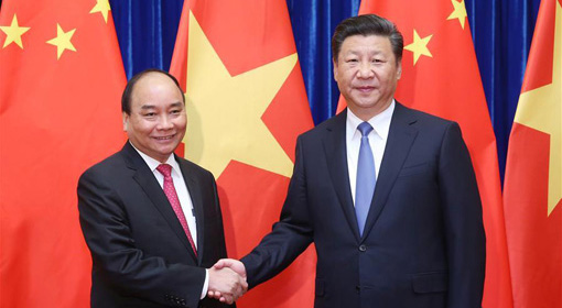 China & Vietnam to resolve their differences over the South China Sea through bilateral talks
