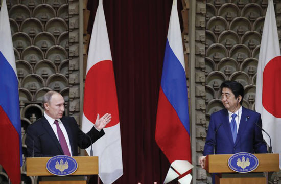 Russian President agrees on economic cooperation during Japan visit but disputed Islands treaty uncertain